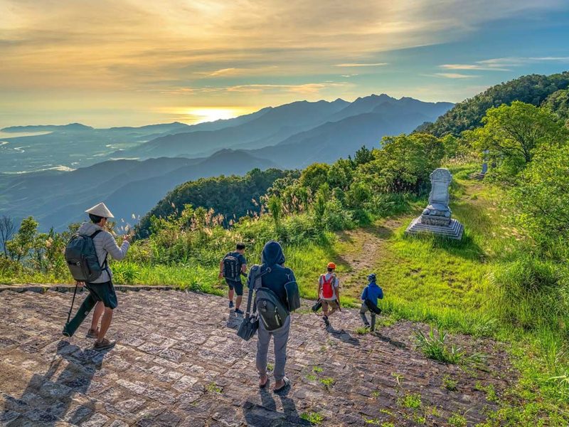 Trekking in Bach Ma National Park at the peak with views over the surrounding mountains and forests