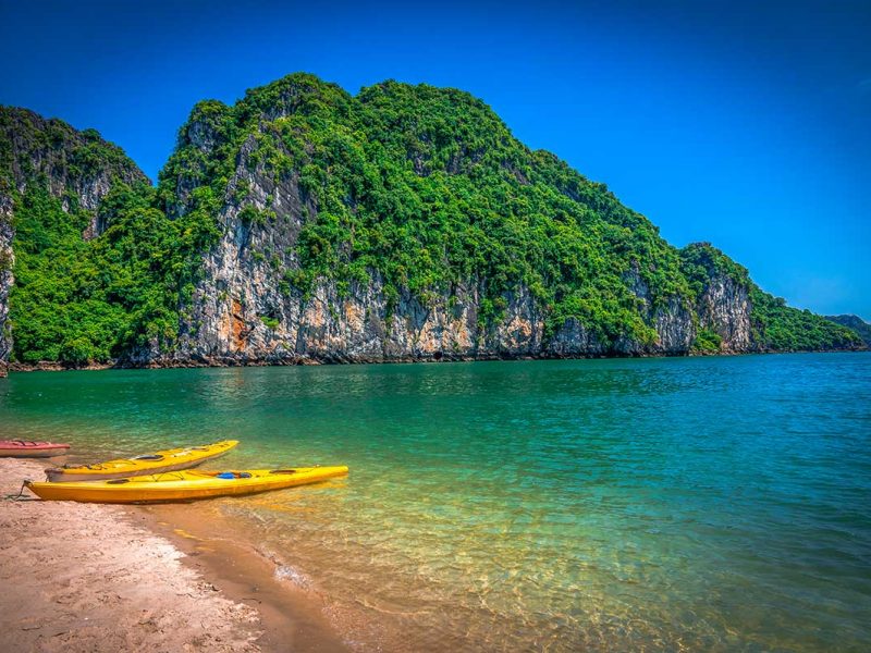 A beach in Bai Tu Long Bay with 2 kayaks