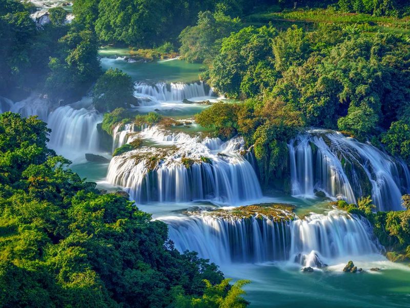 The cascading Ban Gioc Waterfall near the Chinese border — one of the most spectacular natural sights included in northern Vietnam tours.