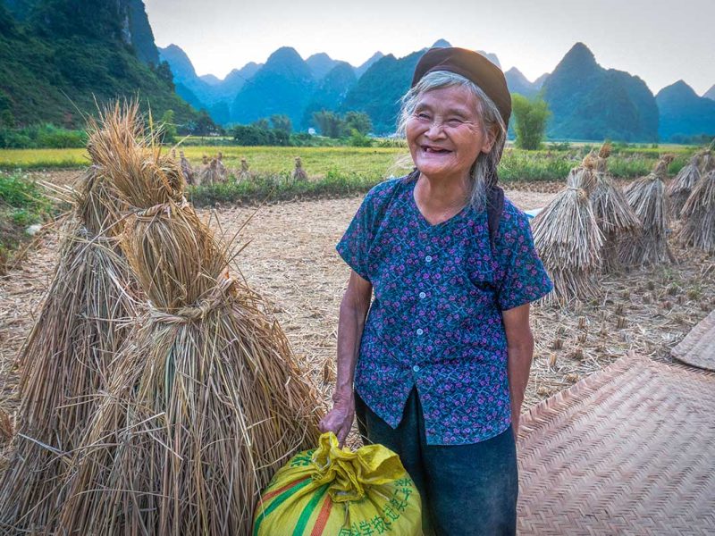 A local woman standing on a countryside path in Cao Bang