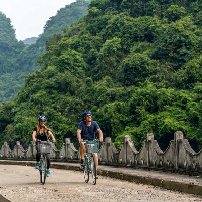 Couple o friends cycling on Cat Ba Island