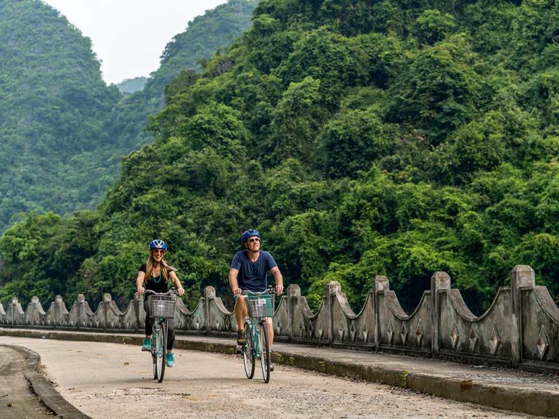 Couple o friends cycling on Cat Ba Island