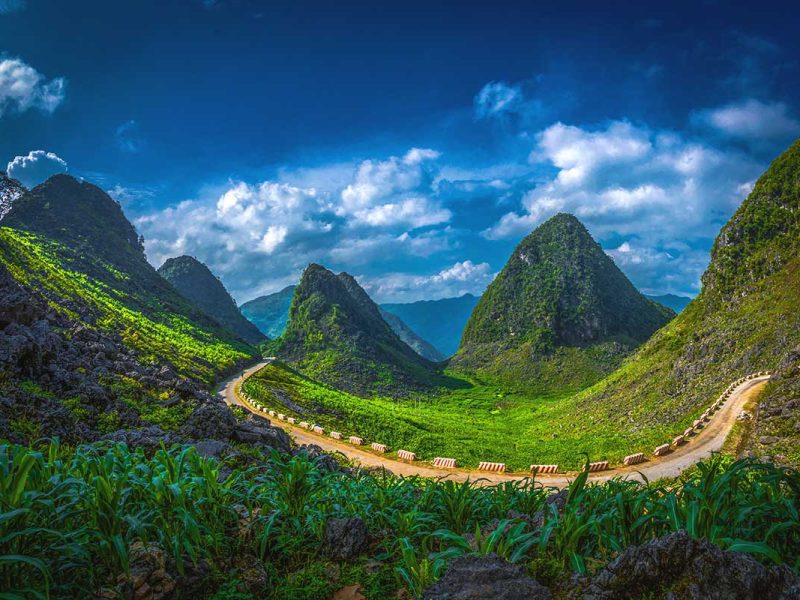 A road with mountain views of Ha Giang, part of Dong Van Karst Plateau Geopark