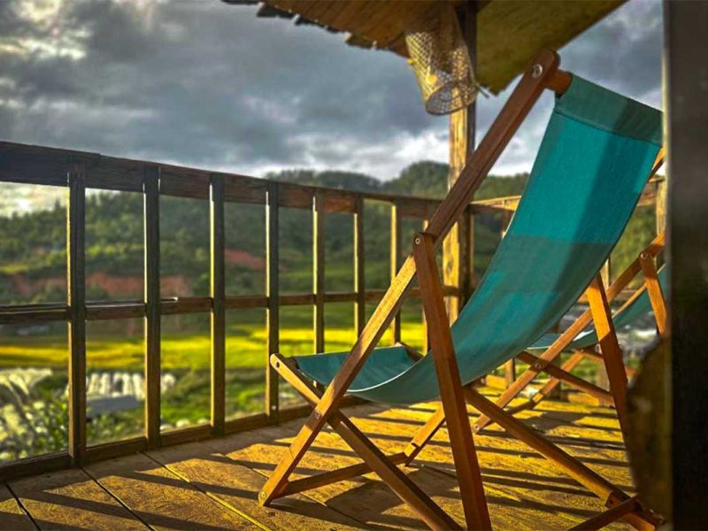 Balcony with chairs of a cabin of Ecolodge Mu Cang Chai