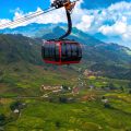 A cable car floating over the rice fields below of Muong Hoa Valley near Sapa on its way to the top of Fansipan Mountain