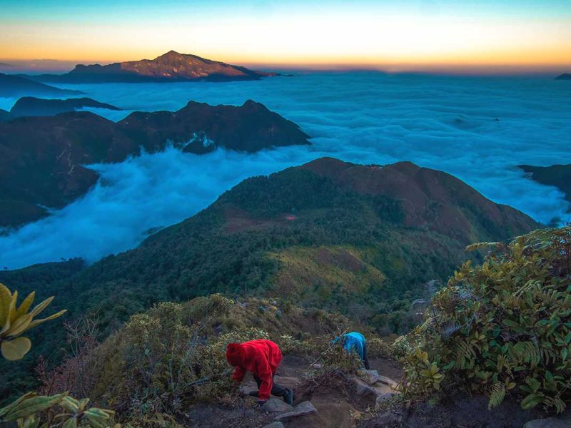 Two people climbing Fansipan Mountan