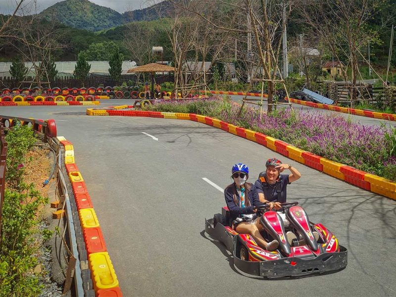 go kart langbiang land 1 Go-kart track at Langbiang Land in Dalat with visitors racing on a curved circuit surrounded by hills