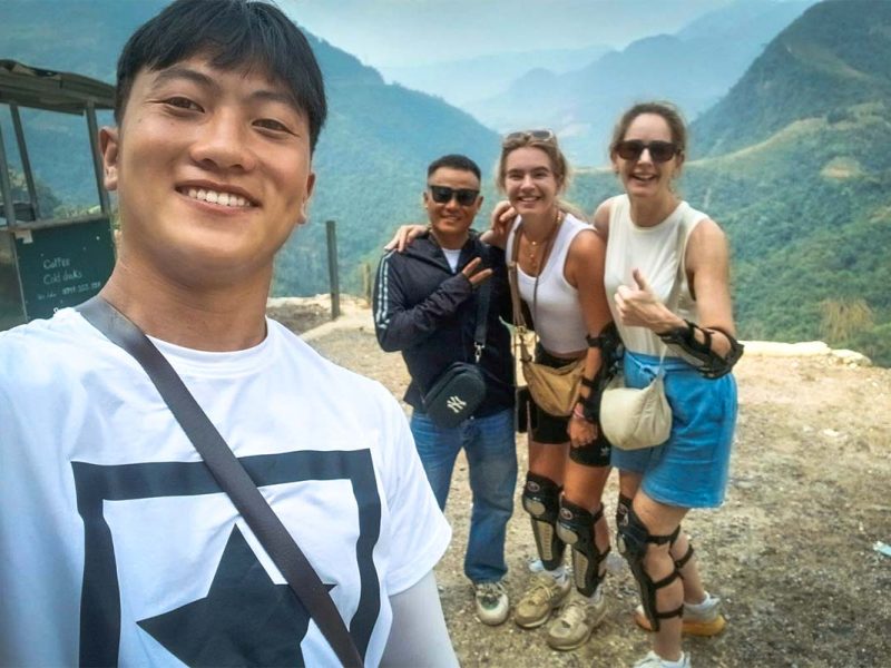 Ha Giang Loop Easy Rider tour with Local Vietnam, showing guests and a local guide at a mountain viewpoint after riding the loop by motorbike
