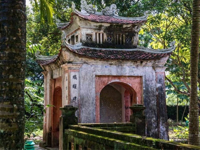 hoa lu ancient capital 1 The old tiled-roof entrance gate of Dinh Tien Hoang Temple with its weathered stone and brick archway, Hoa Lu Ancient Capital, Ninh Binh