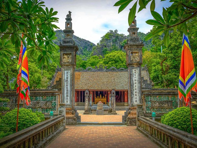 hoa lu ancient capital 5 The Nghi Mon gate and dragon-carved pillars leading into Dinh Tien Hoang Temple, framed by karst peaks, Hoa Lu Ancient Capital