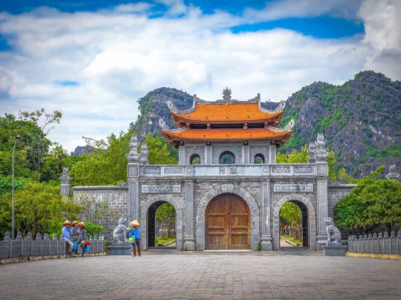 hoa lu ancient capital 6 The stone entrance gate of Hoa Lu Ancient Capital with its arched doorway and limestone-mountain backdrop, Ninh Binh