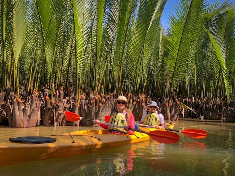 Kayaking through the dense nipa palm mangrove forest on the Hoi An Kayaking & Cycling Tour