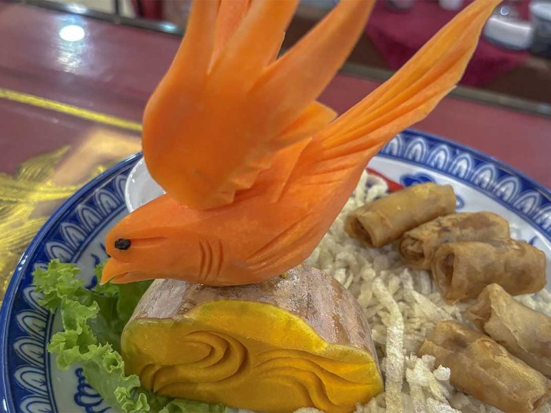 Hue royal food - A Vietnamese dish with spring rolls decorated beautiful with a bird made out of a carrot