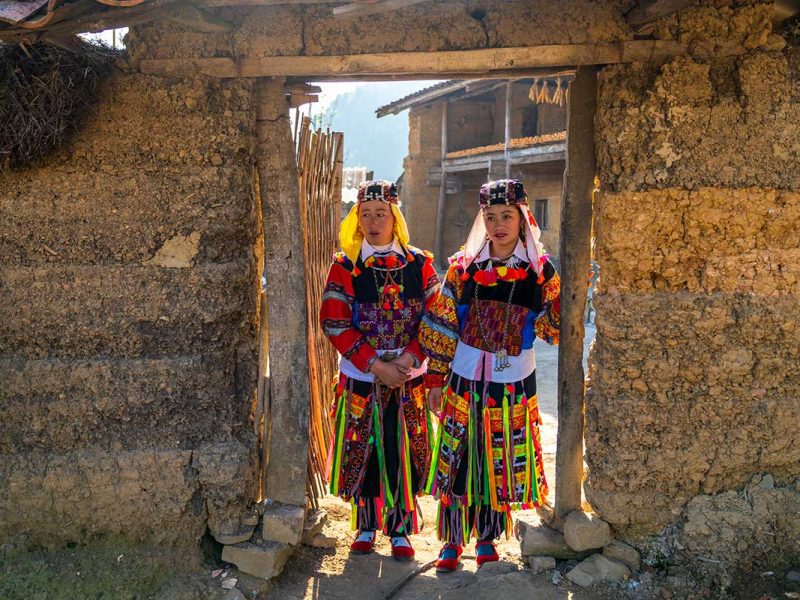 Two very colorful ethnic people from the Lo Lo ethnic group in Lo Lo Chai Village near Lung Cu in Ha Giang