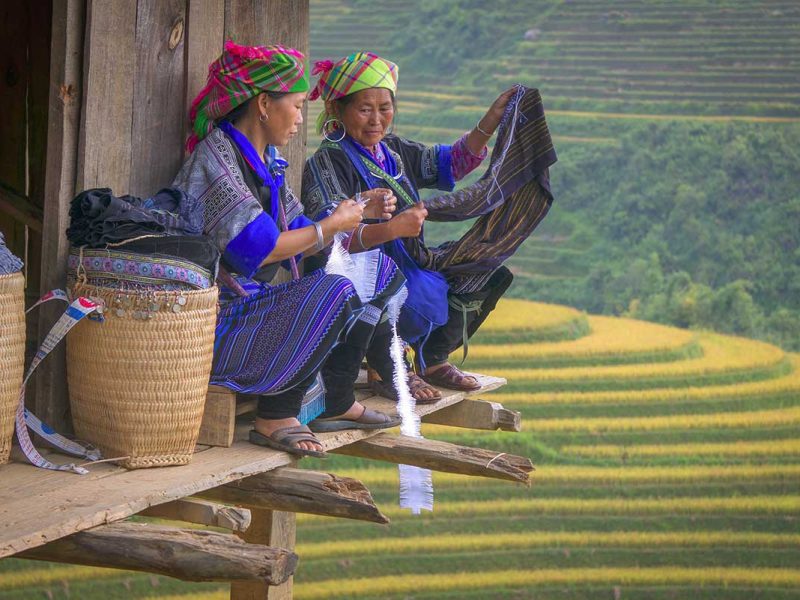 Mu Cang Chai cultural tour with Hmong women weaving traditional textiles overlooking terraced rice fields