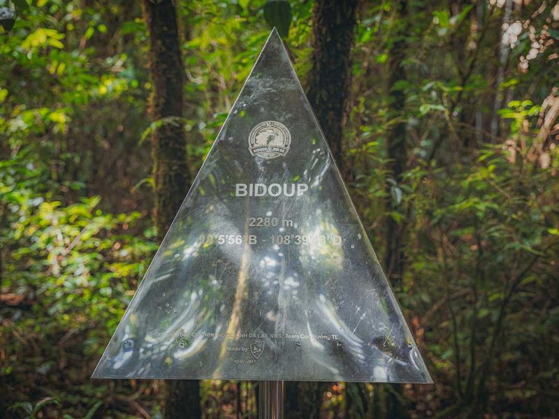 peak sign bidoup mountain dalat 1 Summit marker at Bidoup Mountain in Bidoup Nui Ba National Park, highlighting the high-altitude trekking experience on a Dalat mountain tour