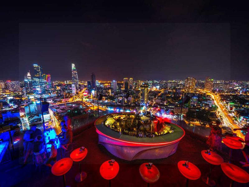 Nightscape of Ho Chi Minh City and rooftop bar.