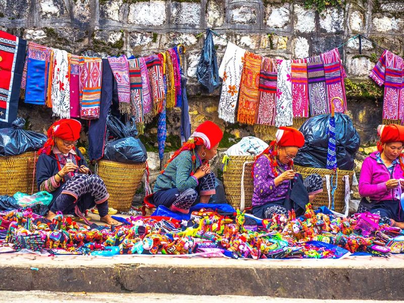 Sapa minority woman selling souvenirs and hand made products