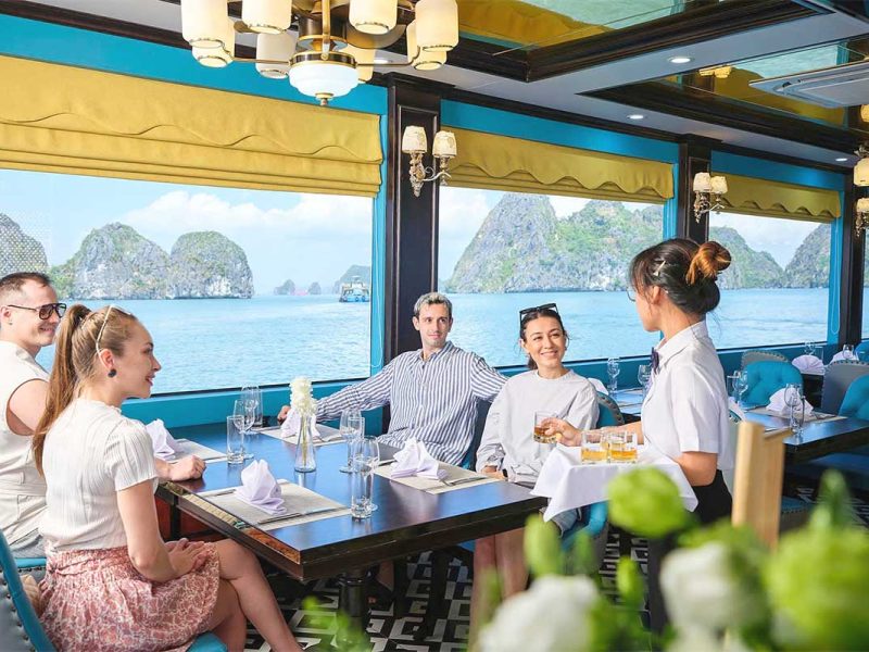 Guests dining on Sea Lion Cruise with Ha Long Bay view