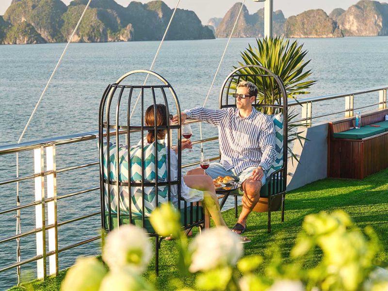 Romantic couple relaxing on Sea Lion Cruise with Ha Long Bay view