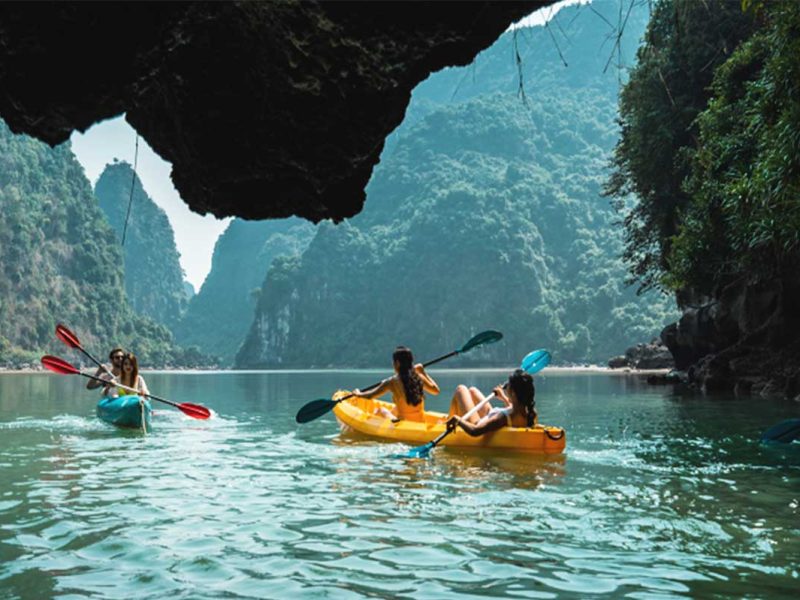 sena cruise lan ha bay 3 Travellers kayaking in Lan Ha Bay part of Sena Cruise itinerary