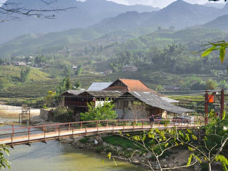 A bridge crossing the river into Su Phan Village near Sapa