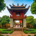 Temple of Literature Gate with Roof: The beautifully tiled and carved roof of a gate at the Temple of Literature in Hanoi showcases intricate craftsmanship.
