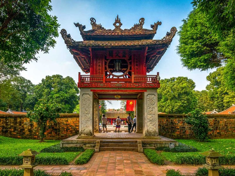Temple of Literature Gate with Roof: The beautifully tiled and carved roof of a gate at the Temple of Literature in Hanoi showcases intricate craftsmanship.