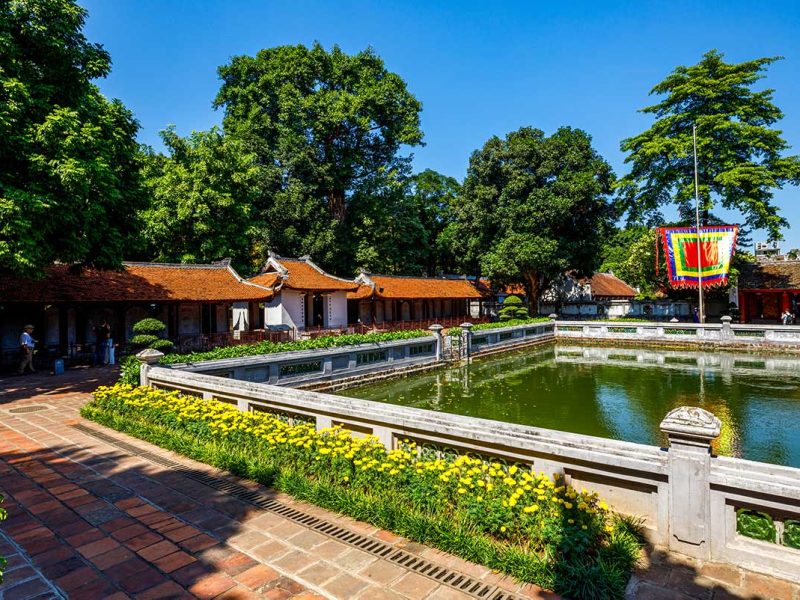 Temple of Literature Pond: A peaceful pond reflects the surrounding architecture at the Temple of Literature in Hanoi.
