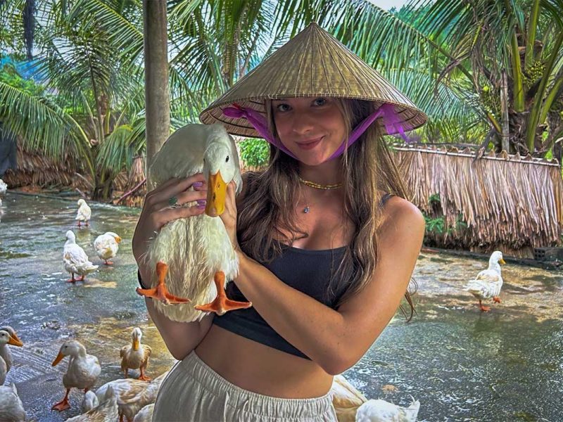 the duck stop 7 A young tourist girl holding a duck at The Duck Stop in Phong Nha