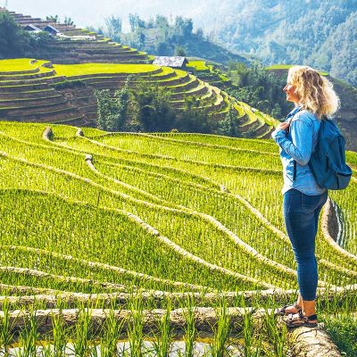 foreign woman making a trekking in Sapa through Muong Hoa Valley