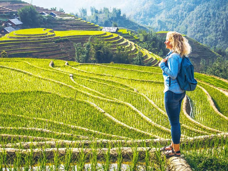 foreign woman making a trekking in Sapa through Muong Hoa Valley