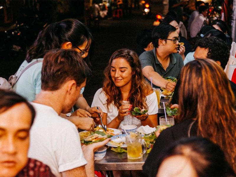 Tourists enjoying a vegan food tour in Ho Chi Minh City
