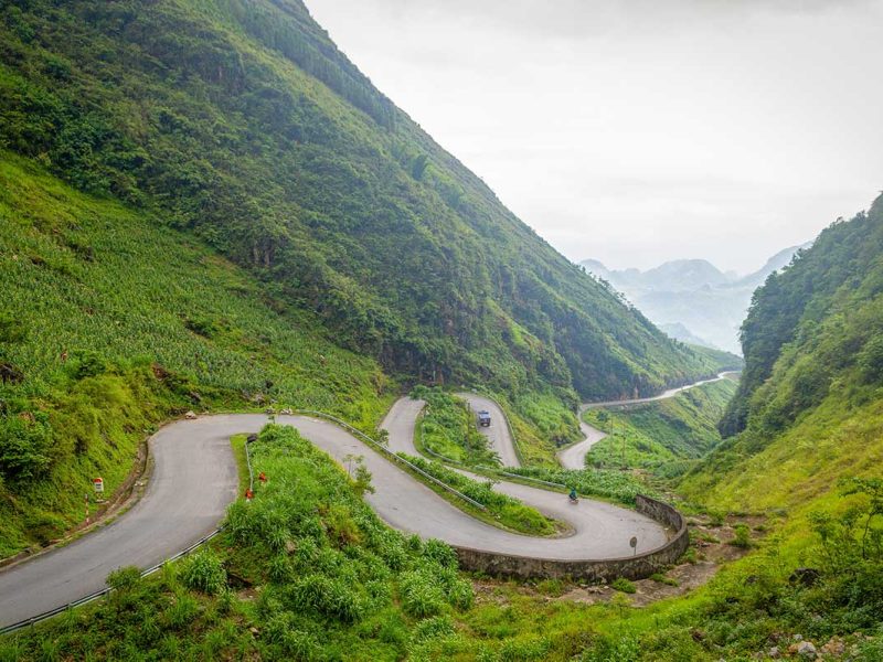 Vietnam adventure holidays in Ha Giang featuring panoramic mountain views and river valleys, highlighting one of the most scenic adventure travel regions in Vietnam